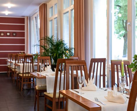 Cosily set tables in the hotel and restaurant in Karlstadt by candlelight